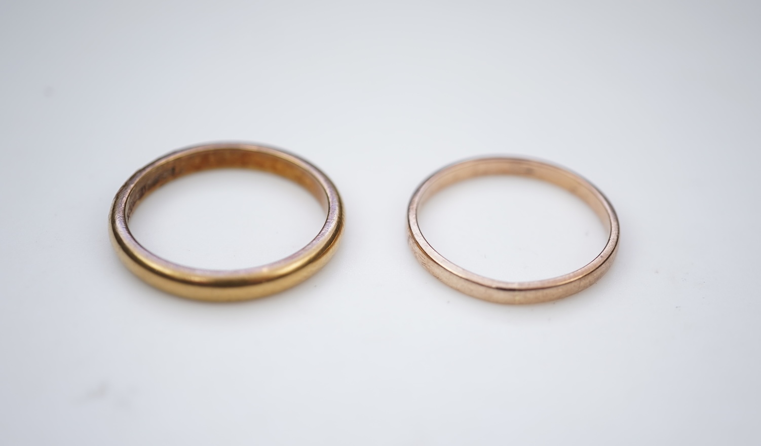 Two gold wedding bands